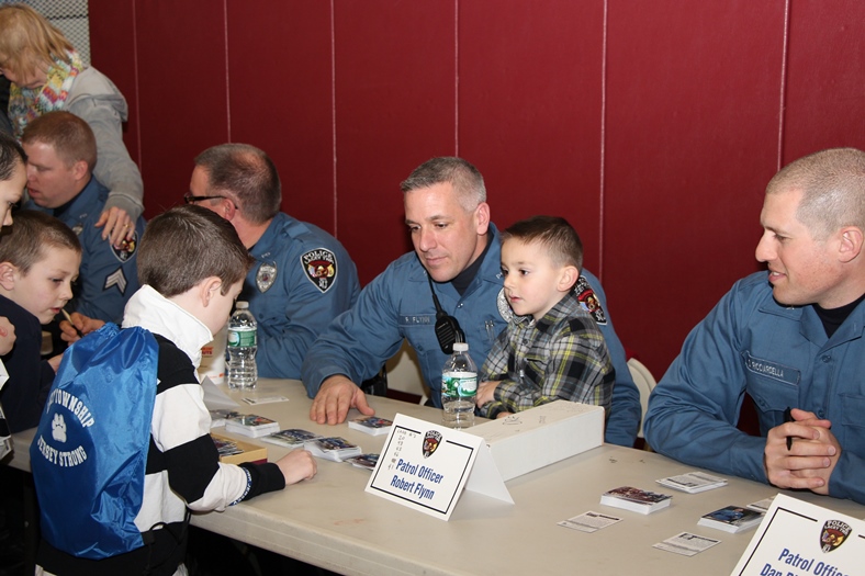 Officer Robert Flynn signing Cards at Meet-the-Officers Day 2014